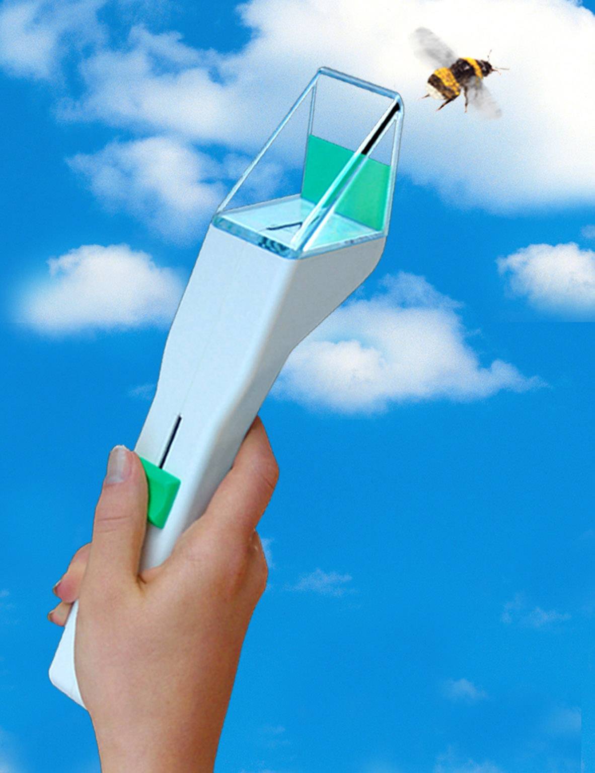 A hand holds a device with a green button and small box, while a bee flies overhead in the sky.