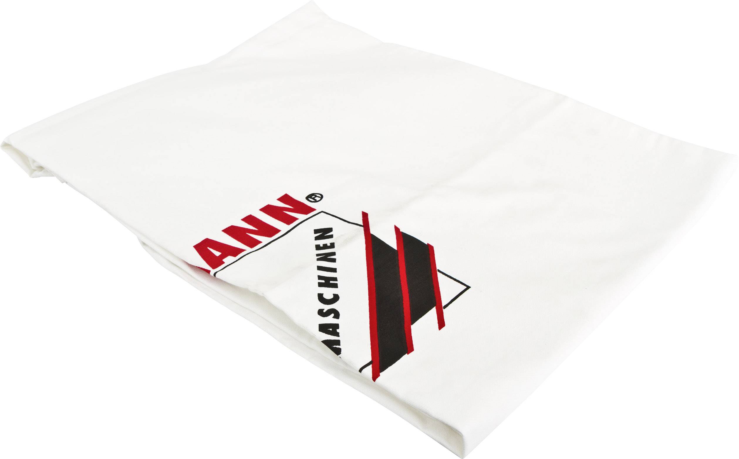 A white cloth with the text 'MAN MACHINE' and a stylised black and red logo at the edge.