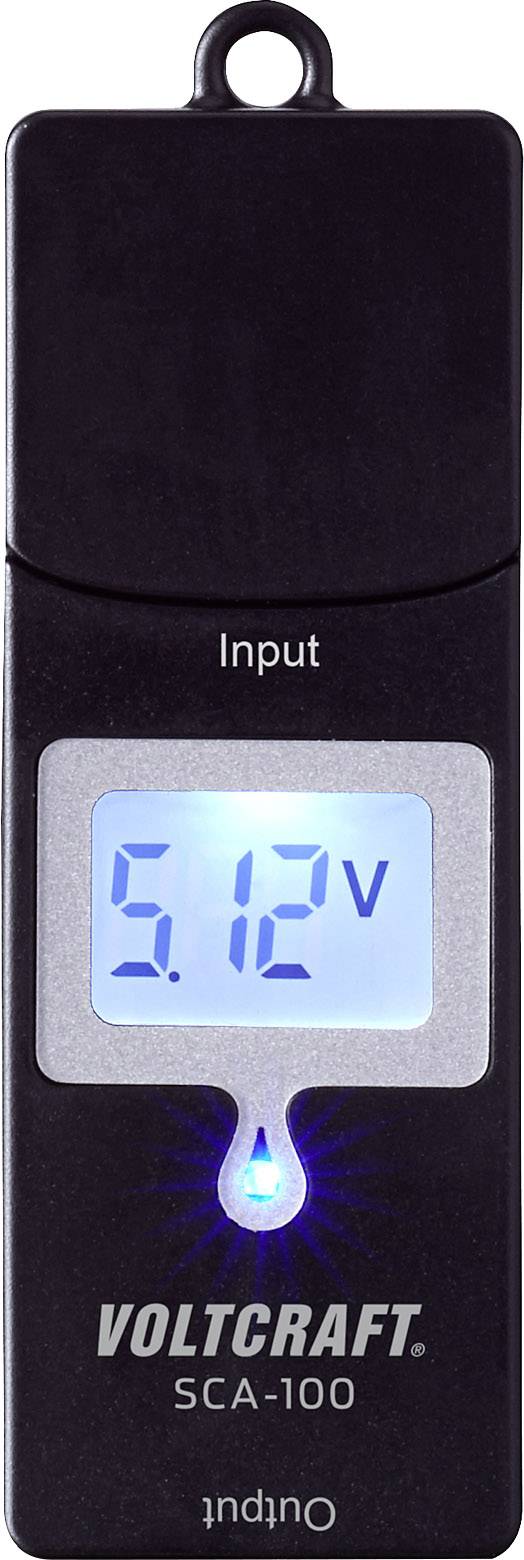 Voltage measuring device with blue screen displays '5.12V'. Labelled with 'Input' and 'Output' at the top and bottom. Brand: Voltcraft SCA-100.
