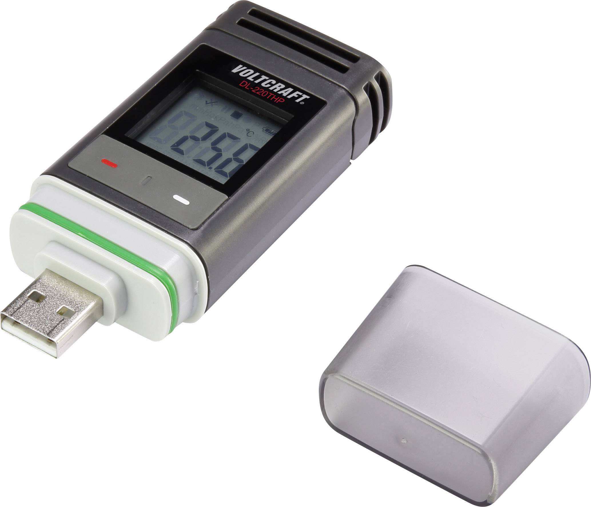 A USB temperature data logger with display shows '22.5°C'. Cover is lying beside it. Device is used for recording temperature data.
