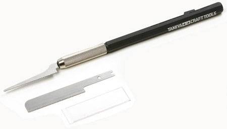 A fine metal saw with a black handle and additional saw blade, suitable for precise craft and model-making work.
