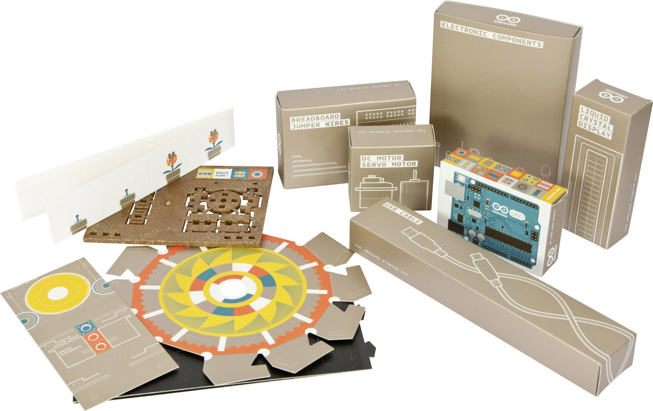 Arduino Starter Kit with various electronic components, including a microcontroller and numerous construction and circuit parts.