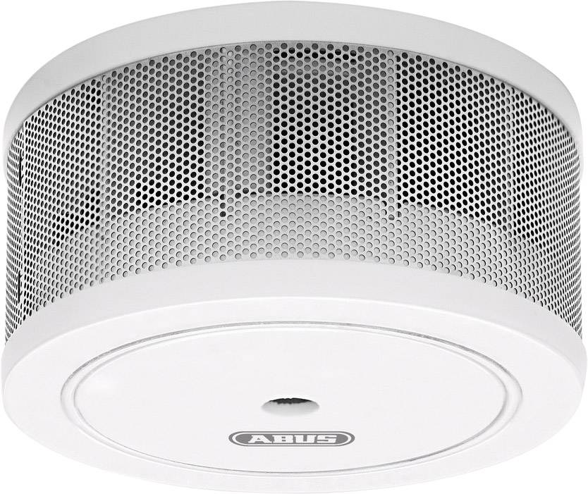 A white smoke detector with ventilation grille and 'ABUS' inscription mounted on a room ceiling.