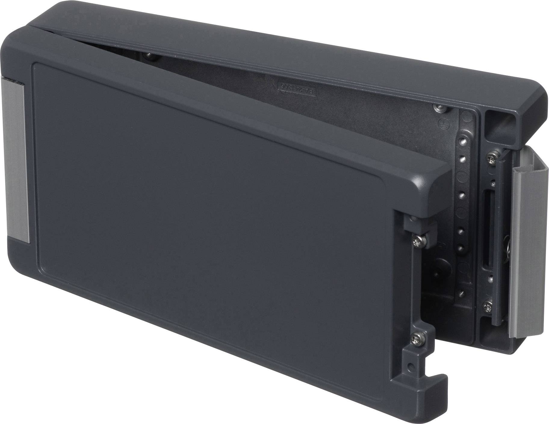 A rectangular, black cover, slightly ajar, reveals technical details and mechanisms within.