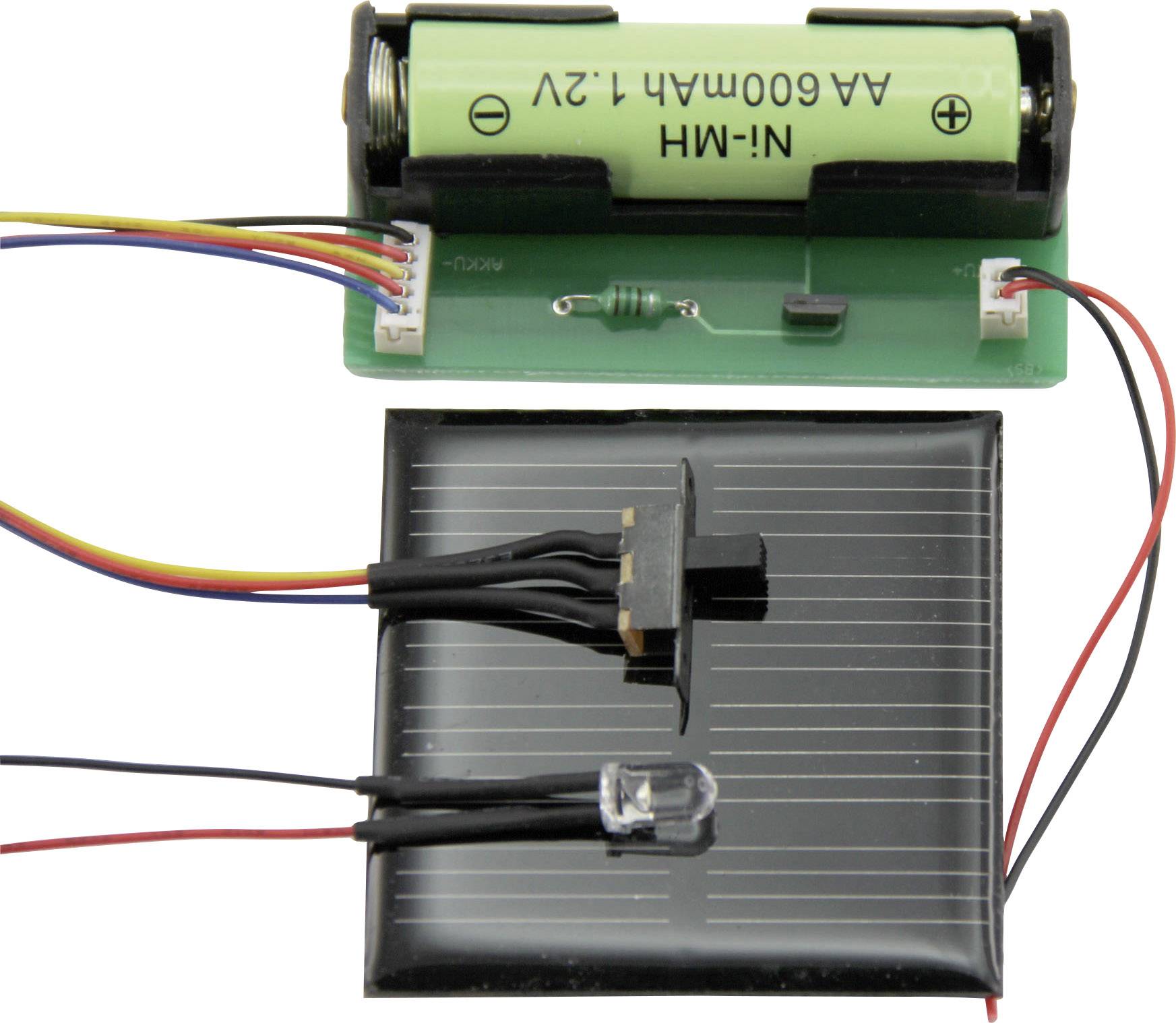 A solar cell is connected to a switch and an LED, next to a battery compartment with an AA battery. Circuit for a project.