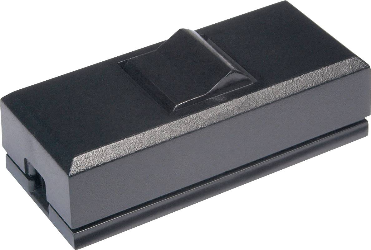A rectangular, black plastic block with a protruding raised section in the centre.
