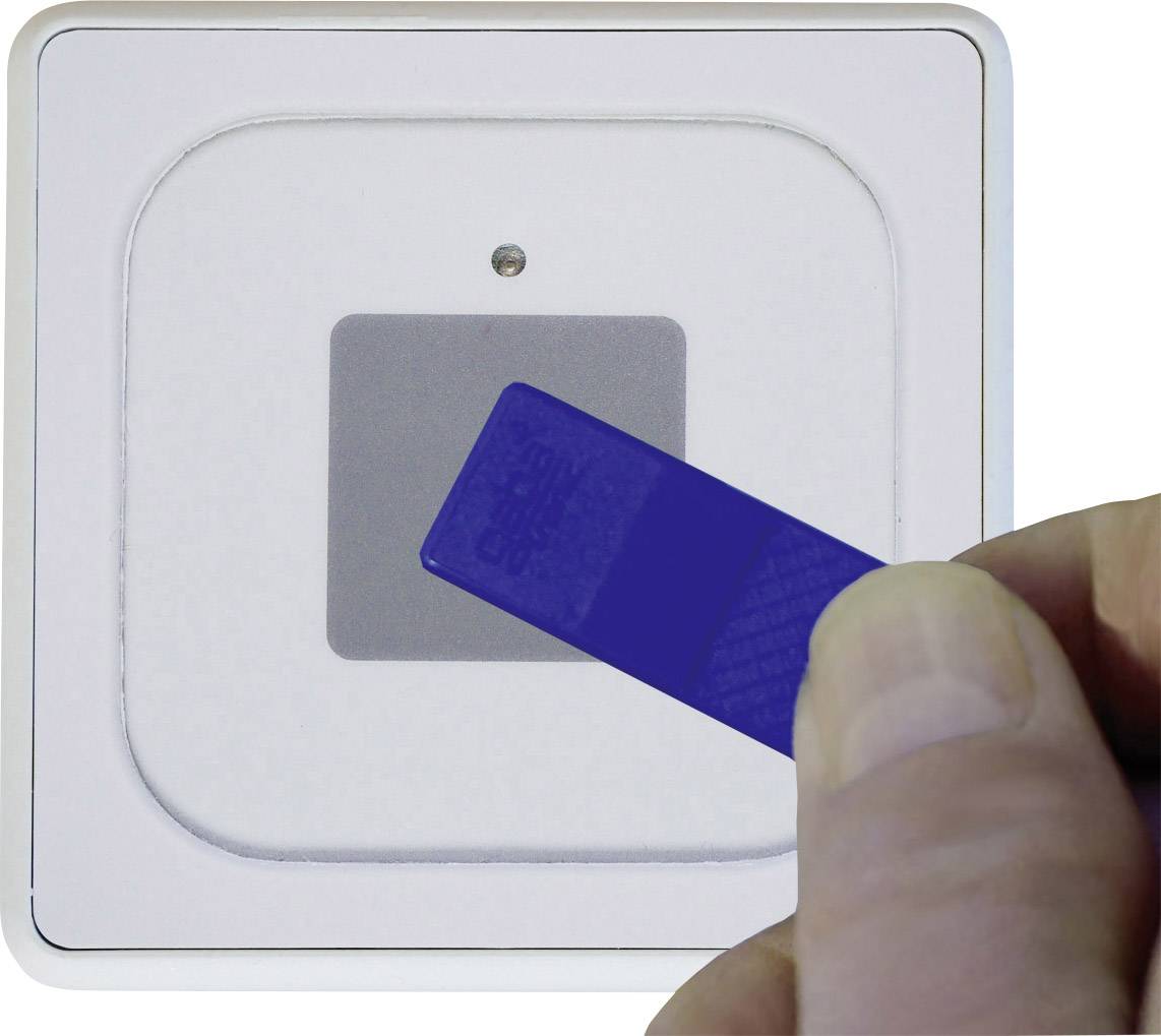 Hand holding blue key fob close to a white RFID reader for access control.