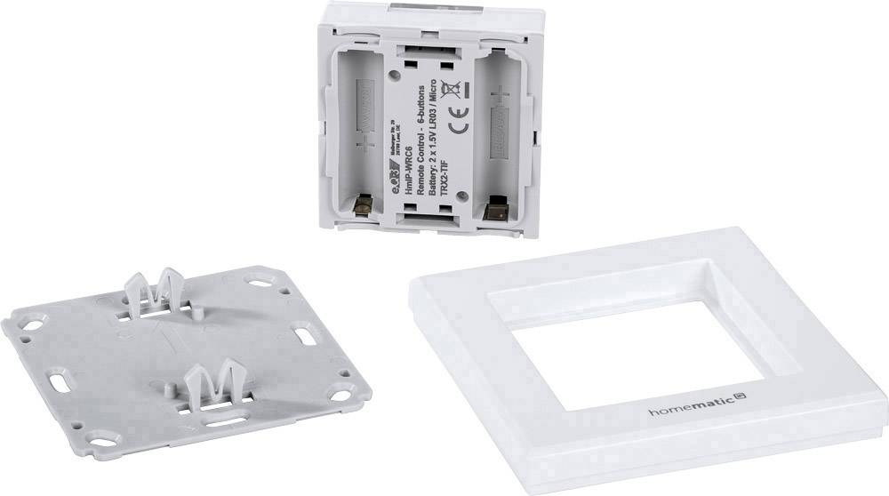 Components of a Homematic IP switch: frame, mounting plate, and switch element.