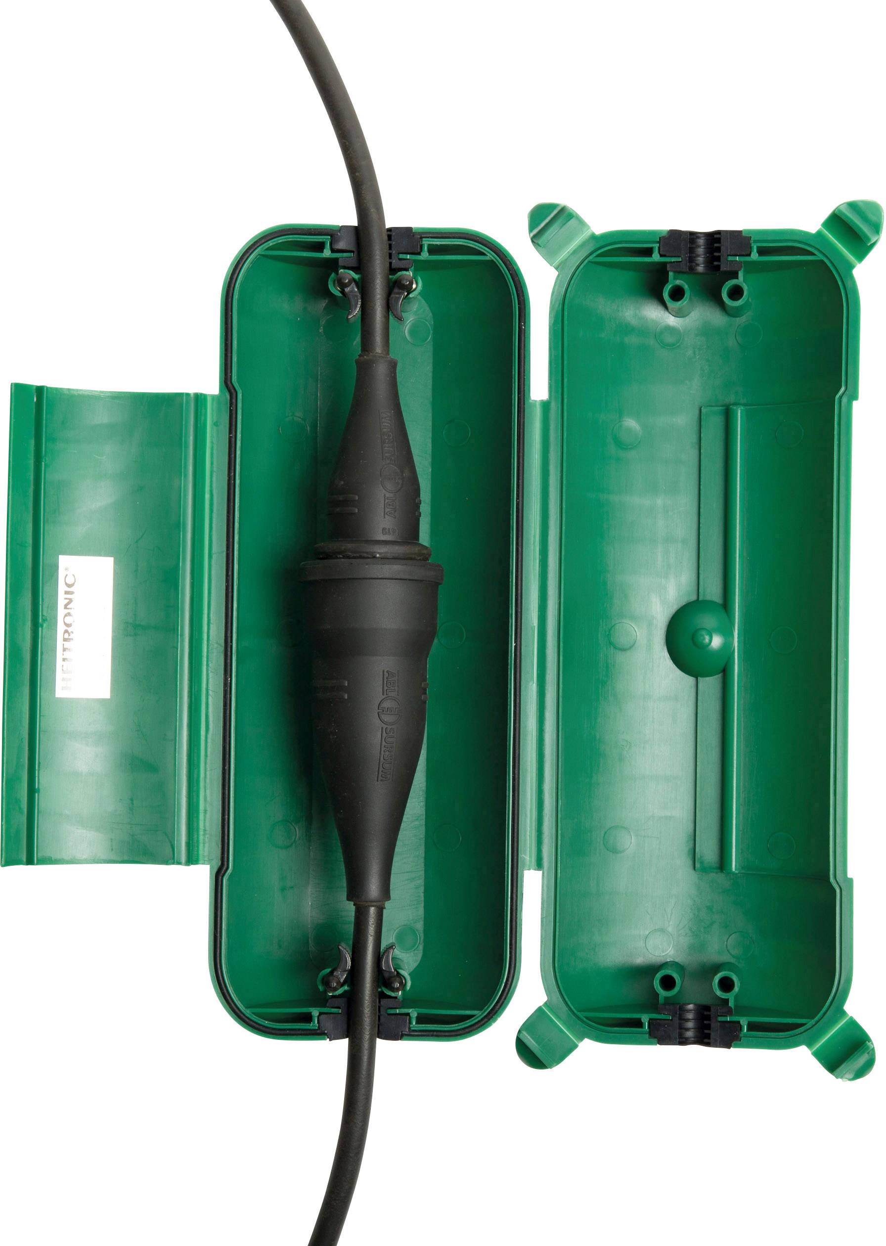 A green, waterproof electrical junction box is open. Inside, an insulated cable is routed through the box.