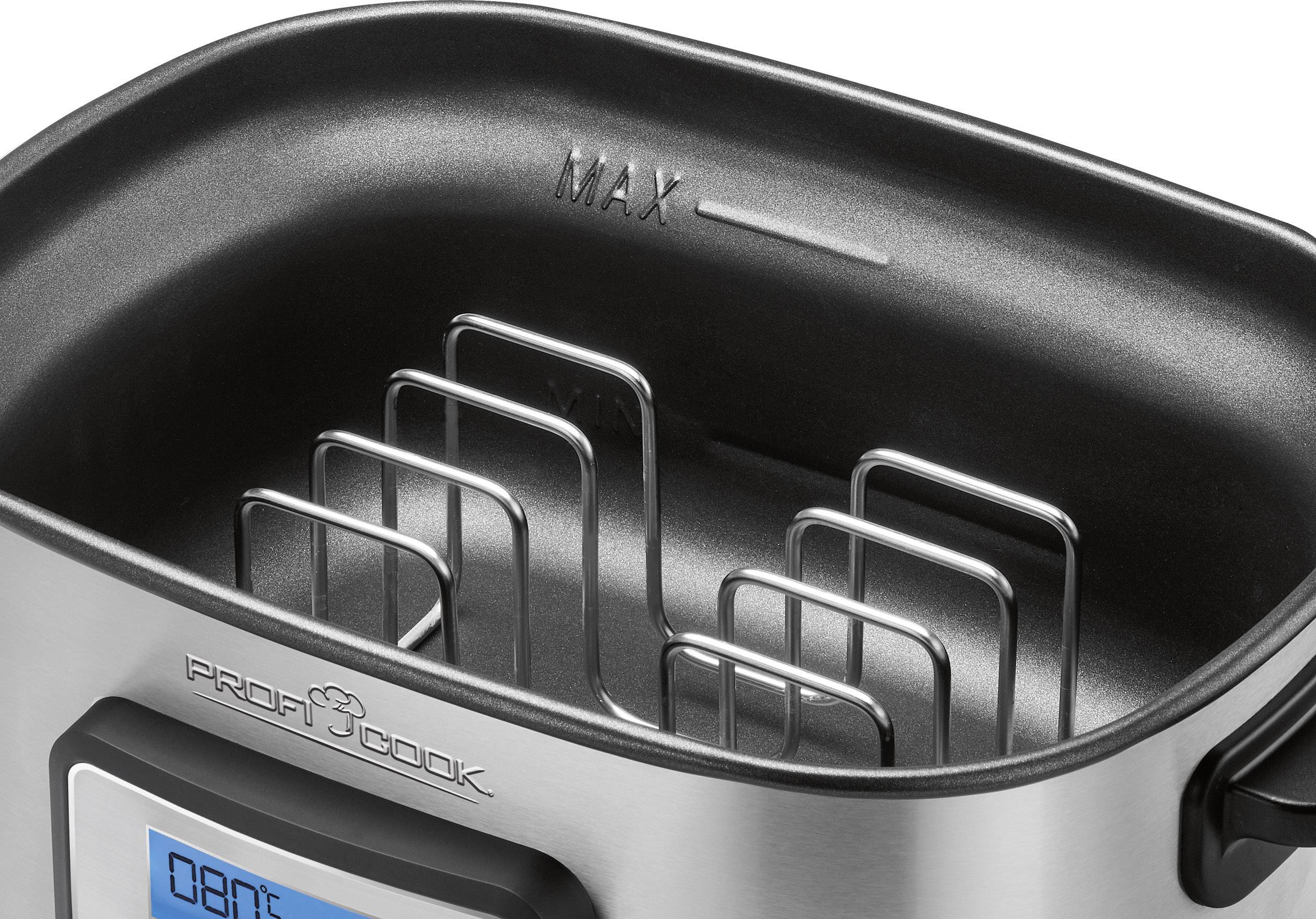 A stainless steel cooker with a removable frame and a maximum level marking on the inside.