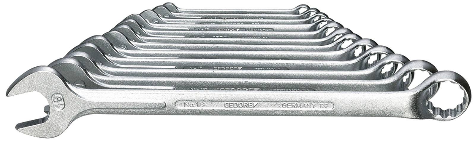 Set of mouth-ring keys, comprising eleven sizes, arranged in a row. The keys are made of polished metal.