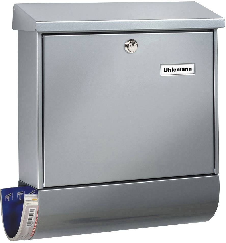 A silver letterbox with a lock, a nameplate reading 'Uhlemann' and a newspaper compartment at the bottom, looks sturdy and functional.