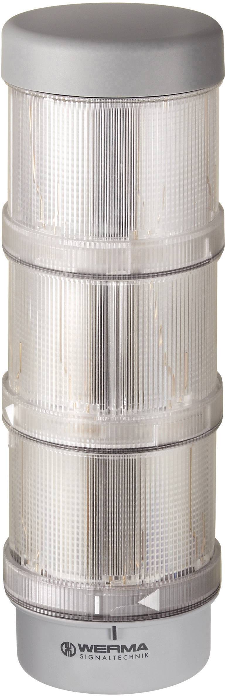 A three-stage signal light made of transparent plastic, mounted on a grey base.
