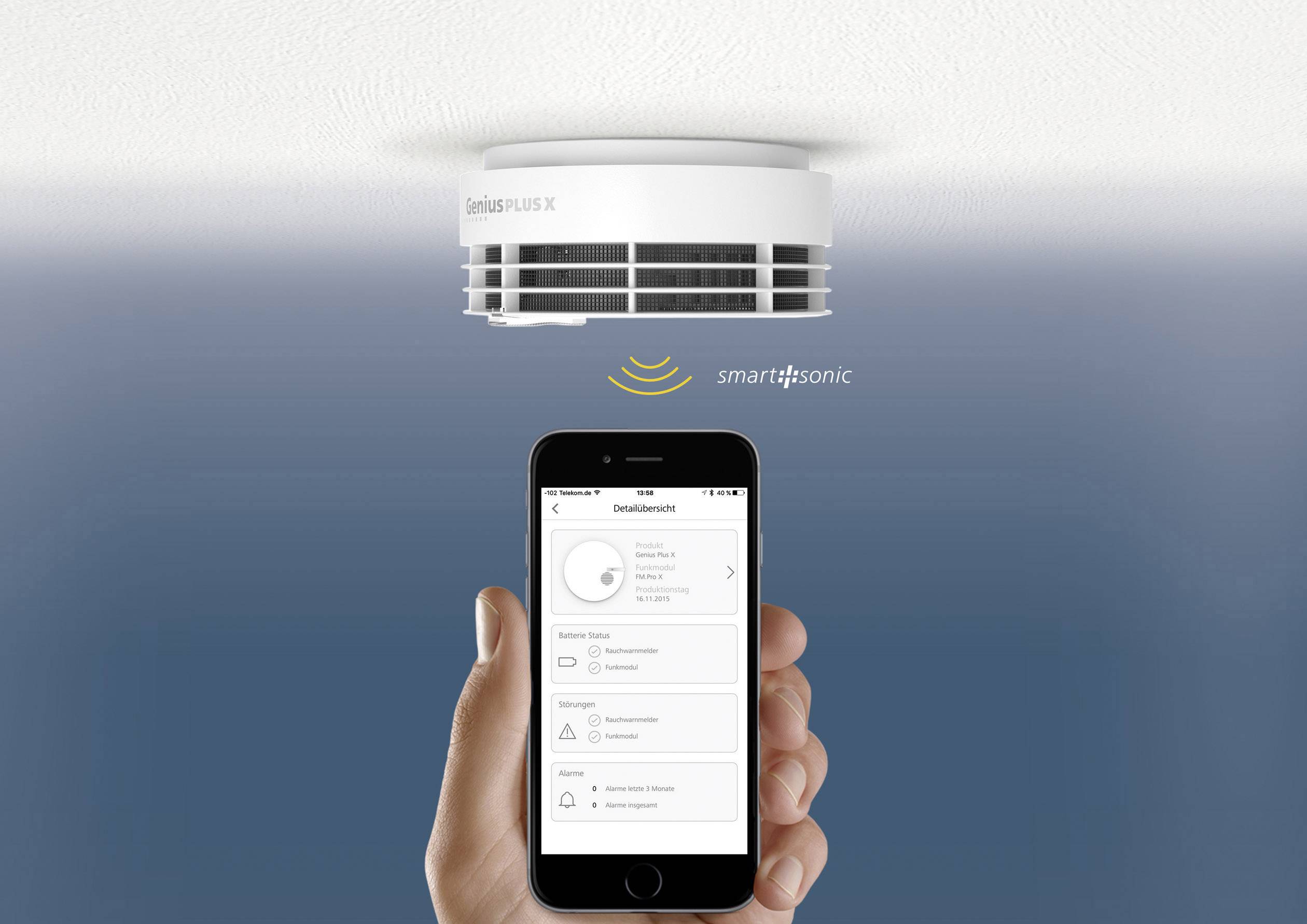 A smoke detector on the ceiling communicates wirelessly with a smartphone, which displays an app with status information.