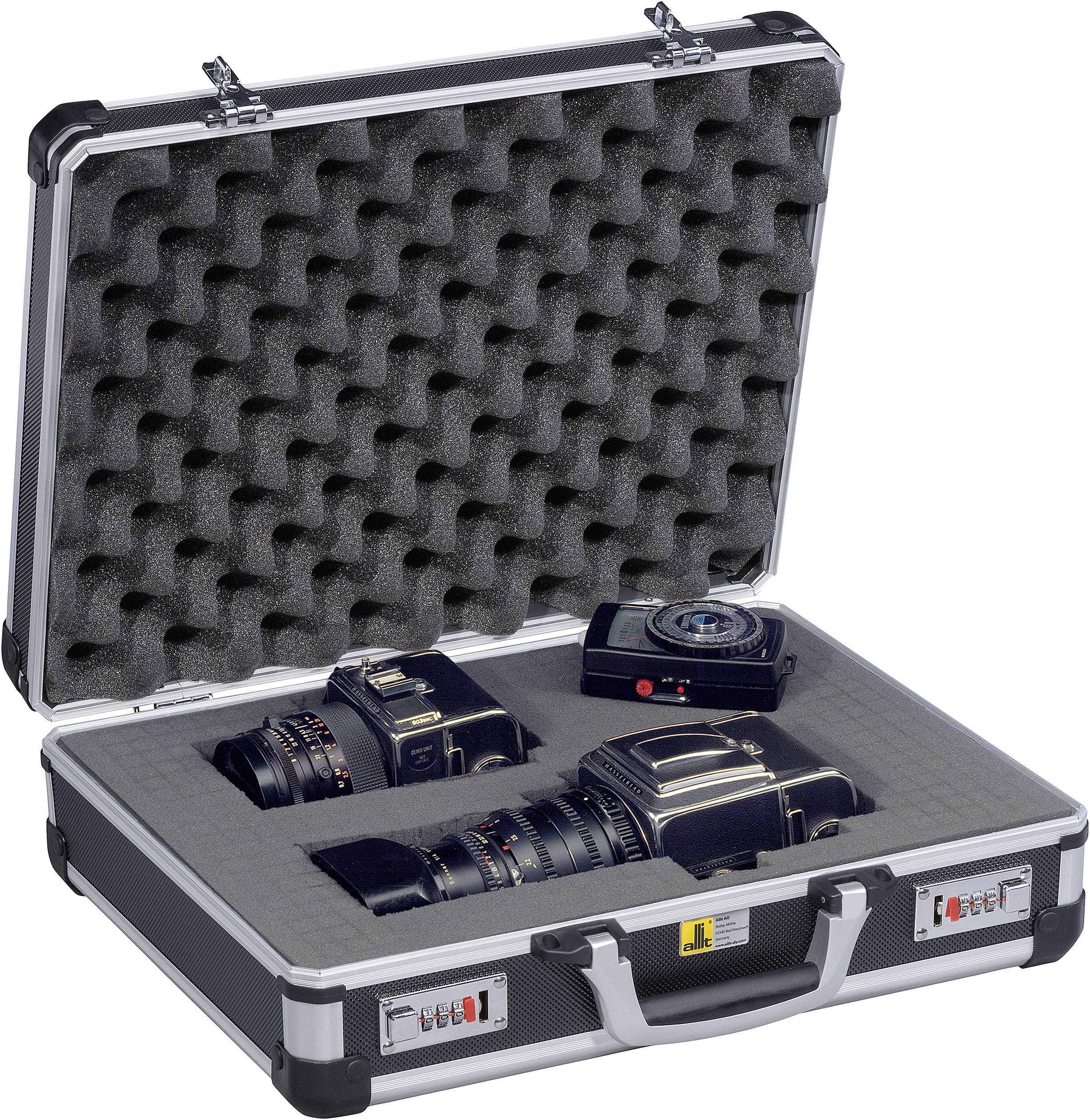 An open aluminium case with foam, with three professional camera lenses carefully positioned inside.