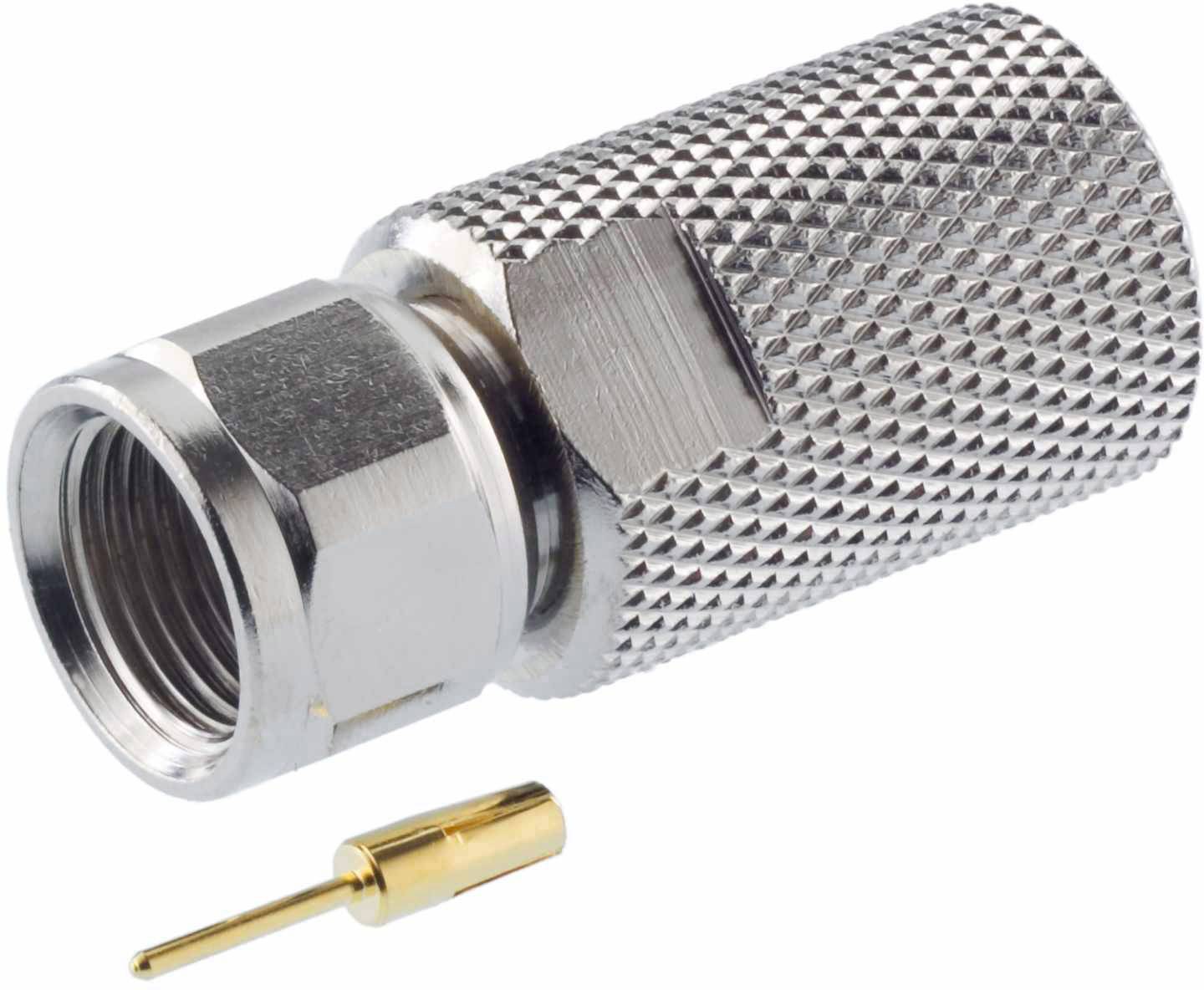 A white coaxial plug adapter made of metal with a ribbed surface, with a gold-coloured pin beside it.