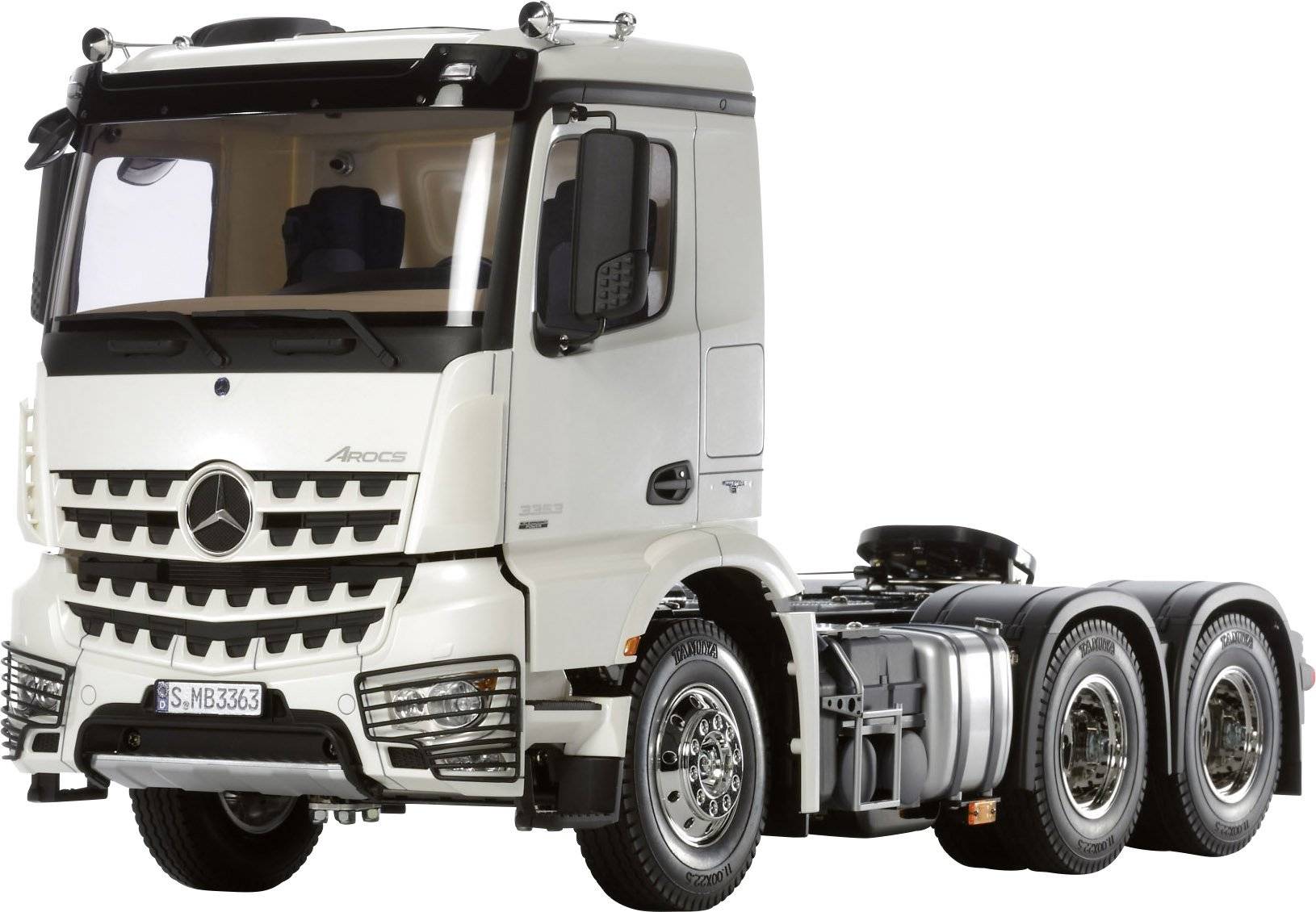 A white lorry with three axles, Mercedes-Benz make, is positioned sideways against a white background.