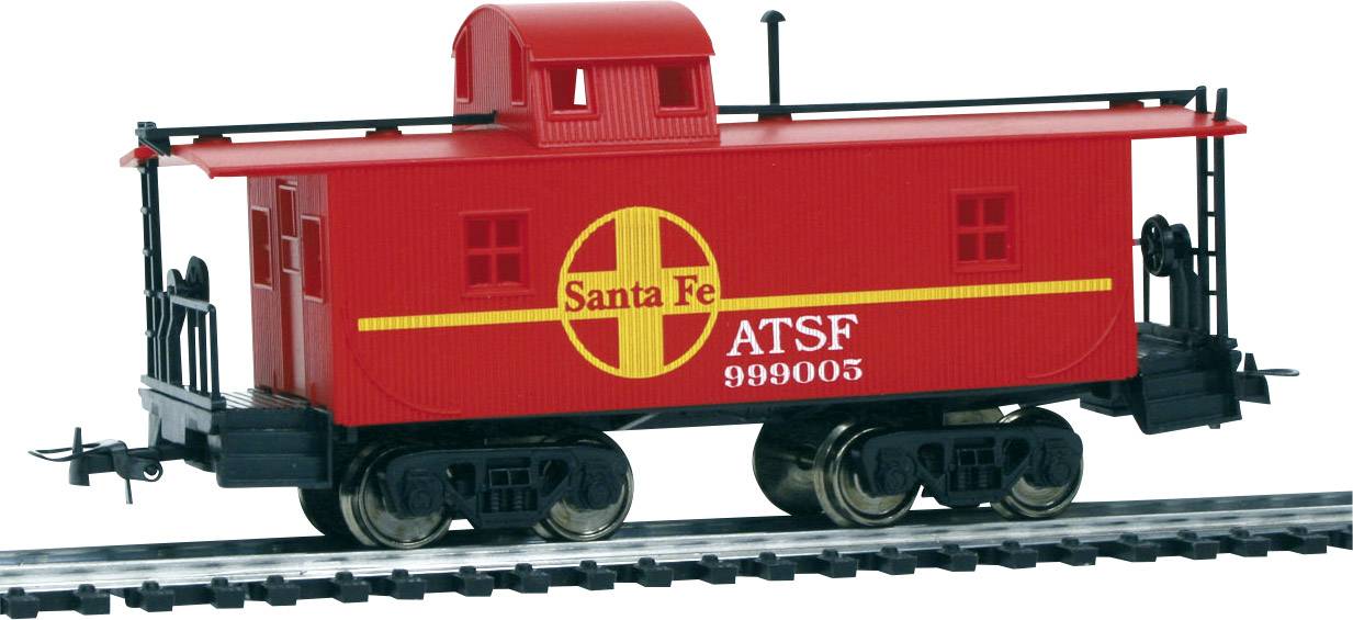 Red model of a Santa Fe train carriage with the inscription 'Santa Fe ATSF 999003' on a railway track.