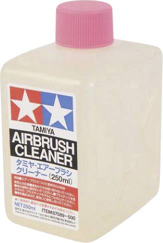 Plastic bottle with a pink cap, with the label 'TAMIYA AIRBRUSH CLEANER'. It is a cleaning solution for airbrush equipment.