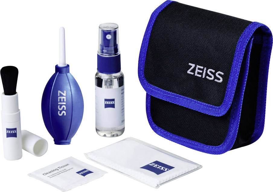 Cleaning kit for optical devices with air blower, cleaning fluid, brush, cloths and carry bag, all featuring the 'Zeiss' logo.
