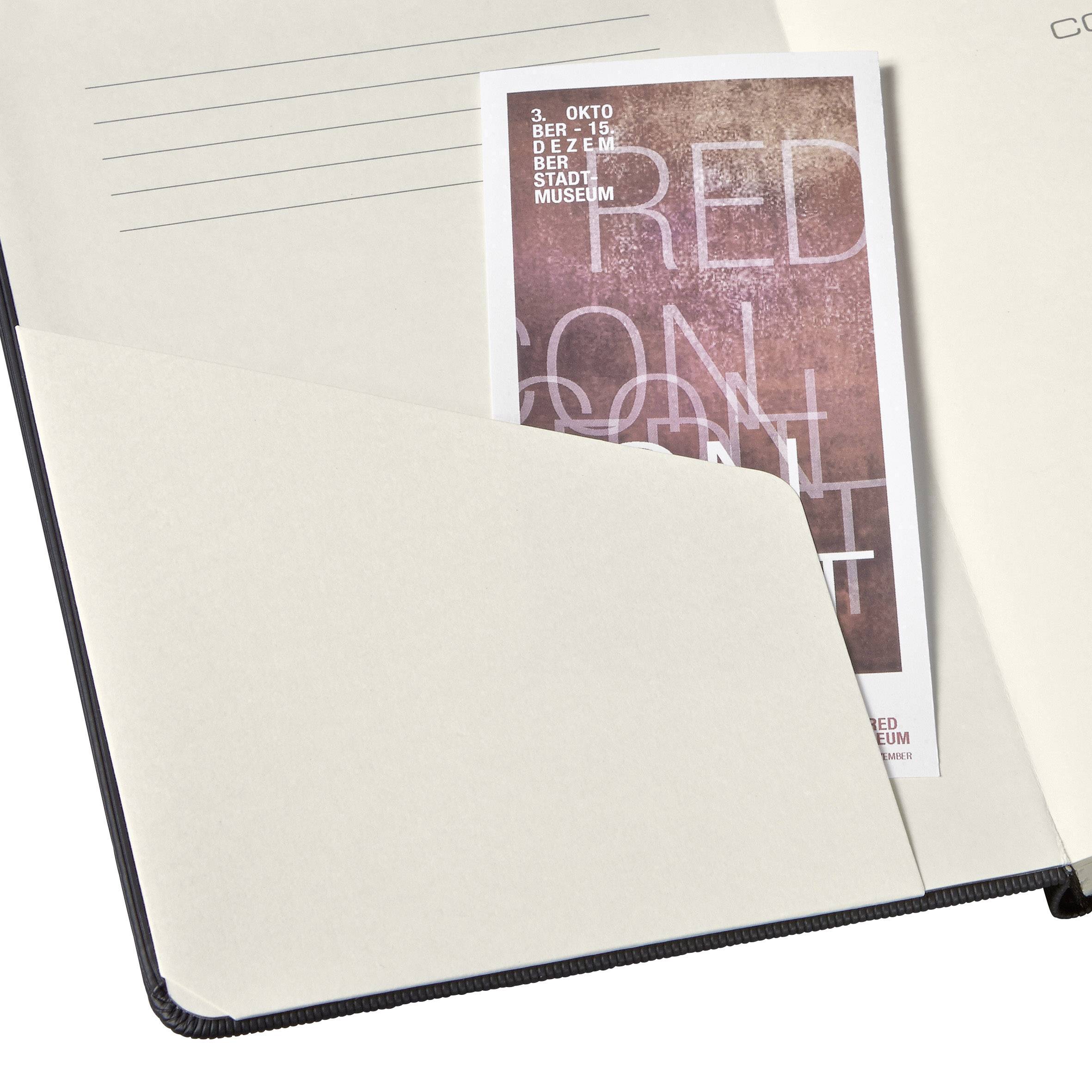 A sheet of paper with lines and a photo of a poster are contained in a folder. The poster displays details for an event in October.