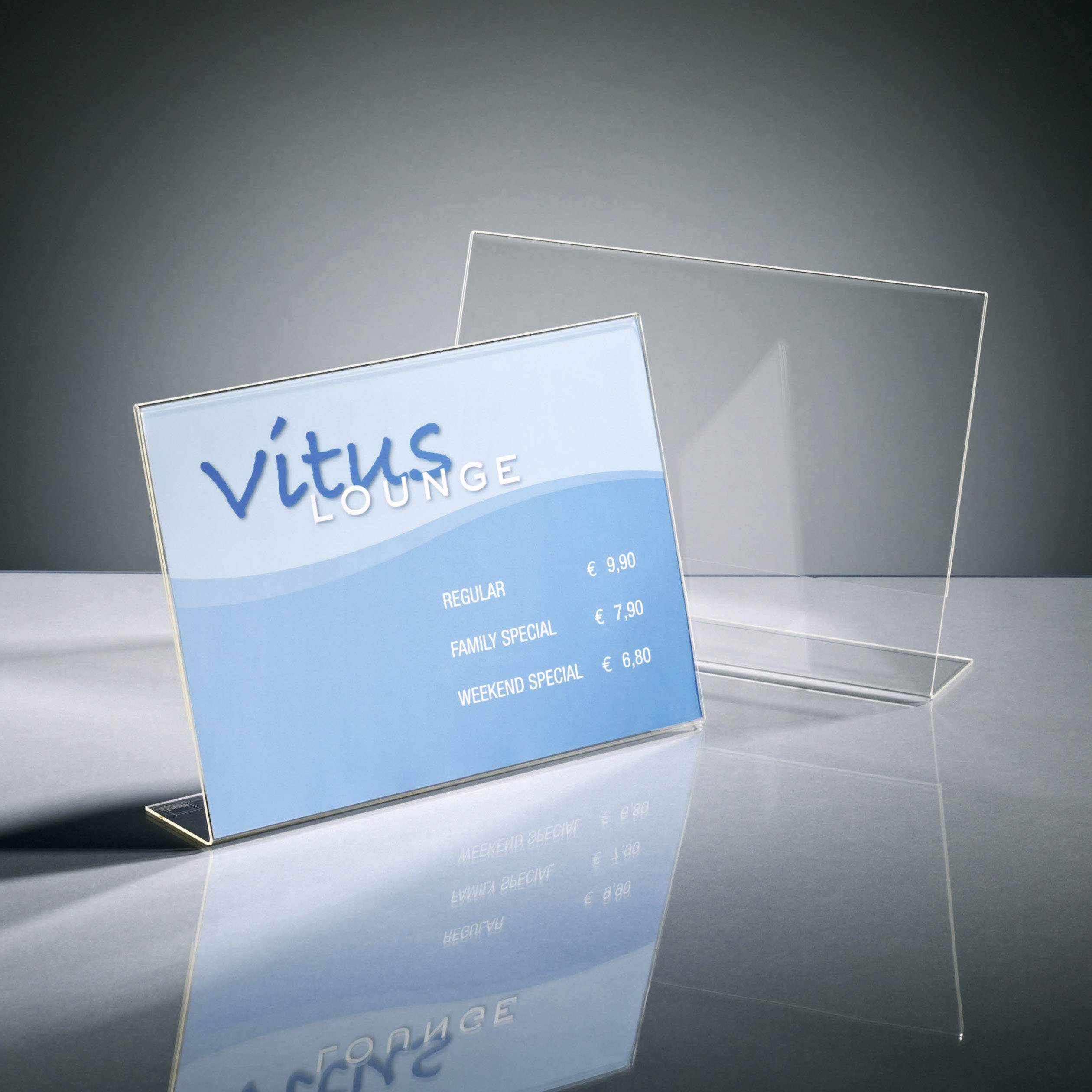 Price list in the 'Vitus Lounge' with £9.90 for Regular, £7.90 for Family Special and £6.50 for Weekend Special. Perspex stand.