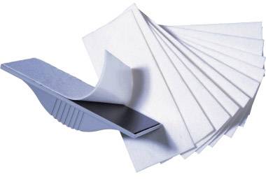 A stack of white papers is spread by a grey plastic holder that lifts the sheets in an arc.
