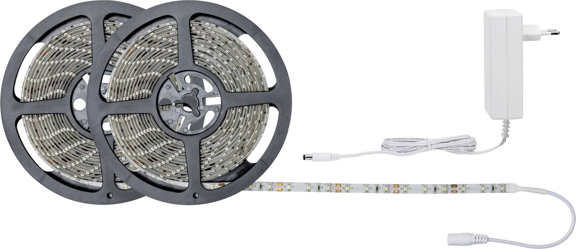 Two rolls of LED light strip and a power supply with cable, ready for installation. Ideal for decorative lighting in interior spaces.