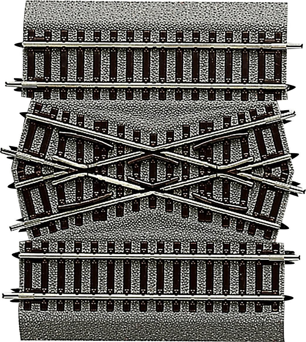 Intersection of model railway tracks in a complex layout, demonstrating directional changes and railway route configurations.