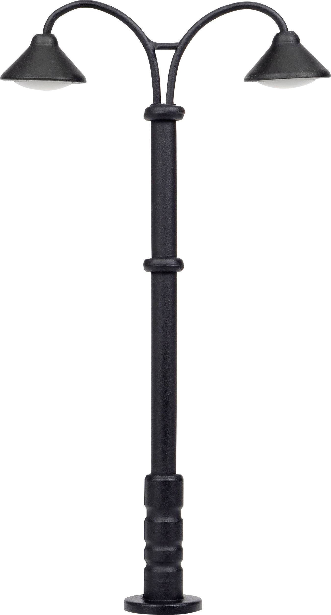 A black, double street lamp post with two curved arms and lampshades pointing downwards.