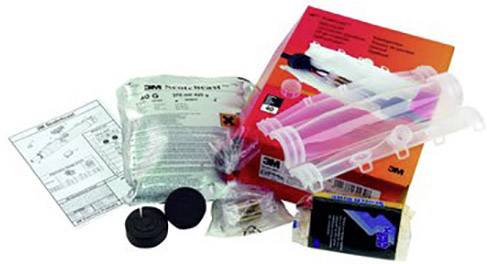 Various medical test kits and accessories on a surface, including packaging, tubes, and instructions, for laboratory purposes.