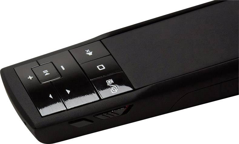 Black remote control with buttons for volume, play/pause, and other functions, positioned sideways on a light background.