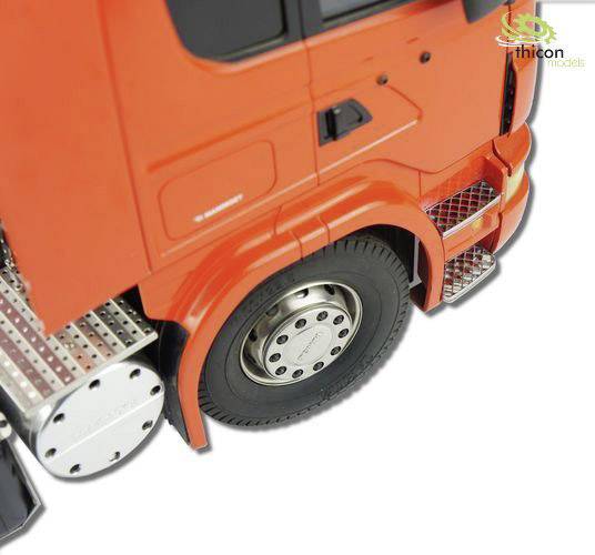 Close-up of a red model lorry with visible rear tyre and side step. The Thicon Models logo can be seen in the top right.