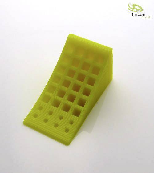 A yellow, wedge-shaped plastic component with a grid pattern on an angled surface. The 'thicon models' logo is positioned in the top right corner.