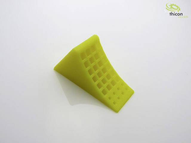 Yellow, wedge-shaped plastic block with a grid surface on a glossy white background. The Thicon Models logo is positioned in the top right corner.