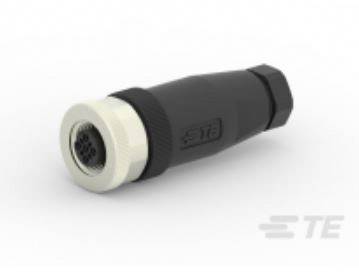 A black, cylindrical plug with a white end and visible metal contacts, lying on a surface. 'TE' marking visible.