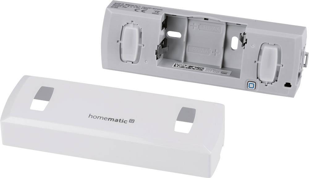 An opened Homematic IP device with visible mounting and connection areas, and a removed cover housing.