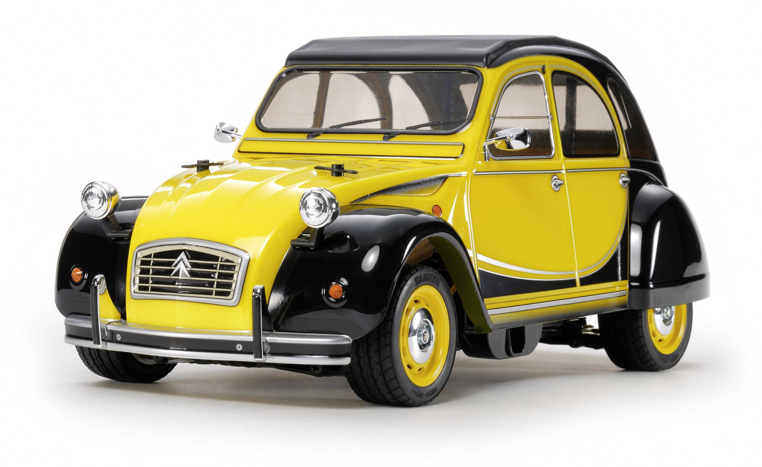 A yellow and black vintage Citroën 2CV car, viewed from the front and slightly from the side. The car has round headlights.