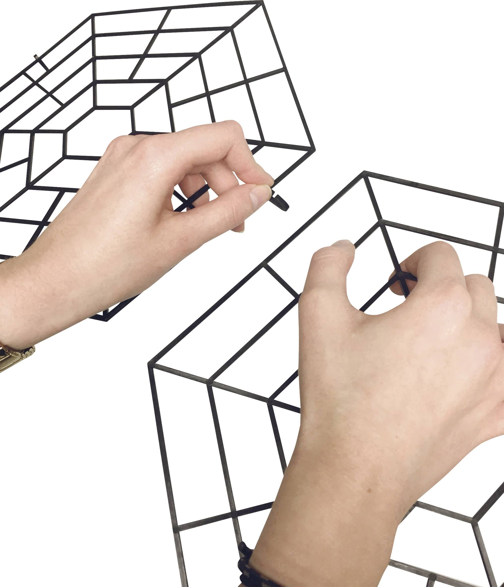 Two hands hold black wire models of cubes that are visually nested within each other.