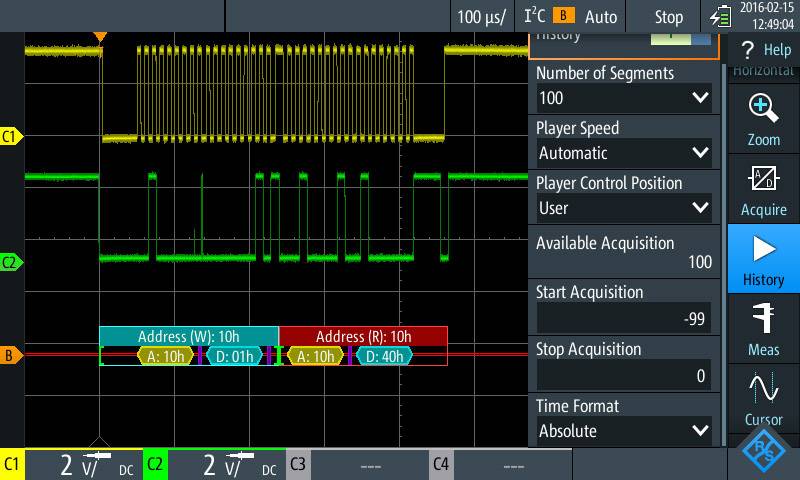 A digital oscilloscope screen displays signals with a yellow and green waveform diagram and address information at the bottom.