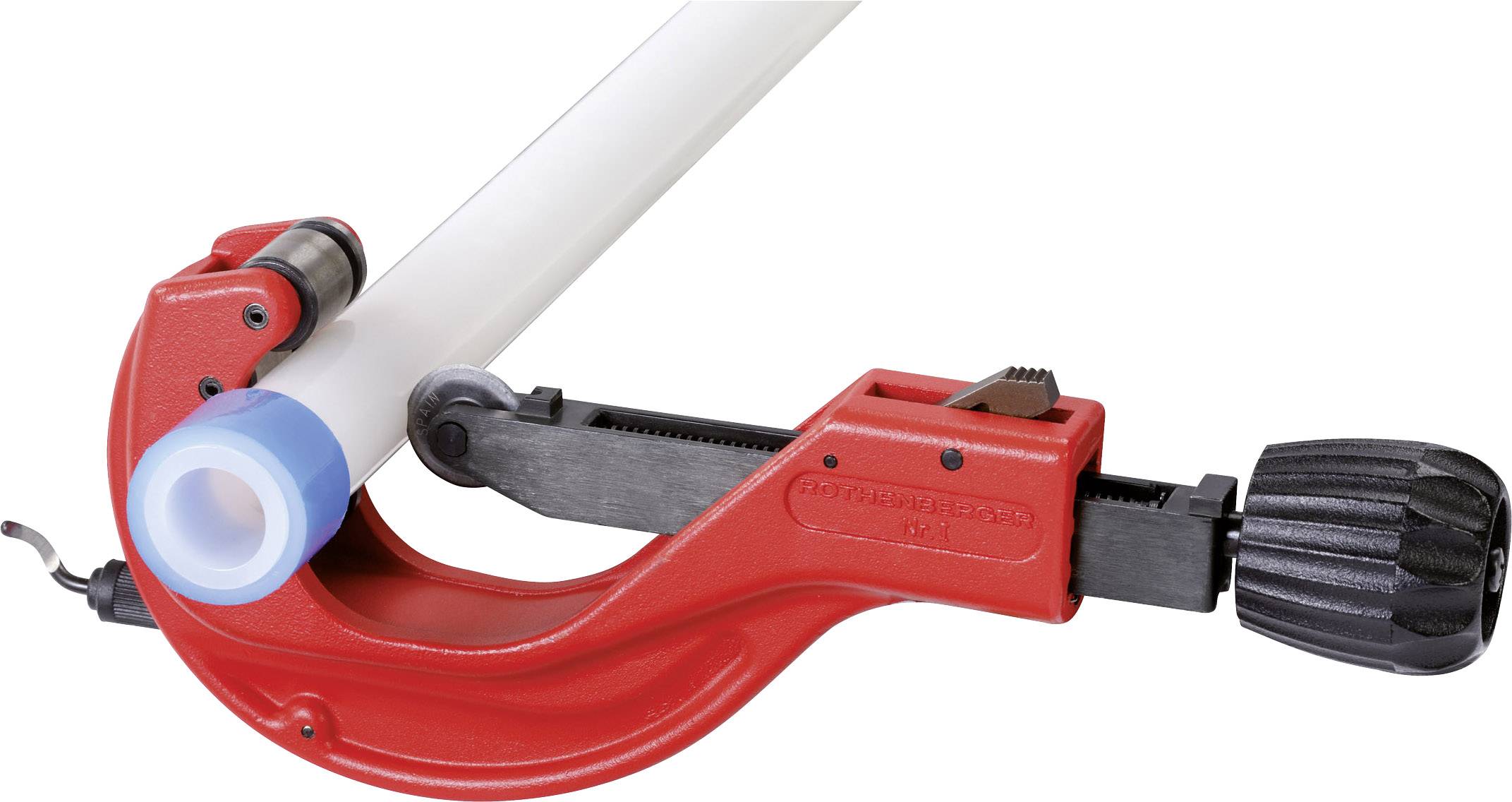 A pipe cutter is cutting a white plastic pipe, demonstrating the tool in action with an adjustable cutting wheel.