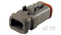 Grey rectangular connector with a red sealing ring, positioned horizontally, used for electrical connections.
