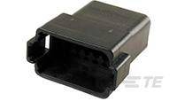 Black, rectangular plastic plug with multiple holes for connecting electronic devices. 'TE' marking visible.