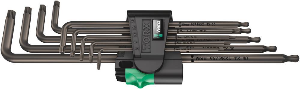 Set of elongated tools with angled ends, in a black holder. Each tool has different size markings.
