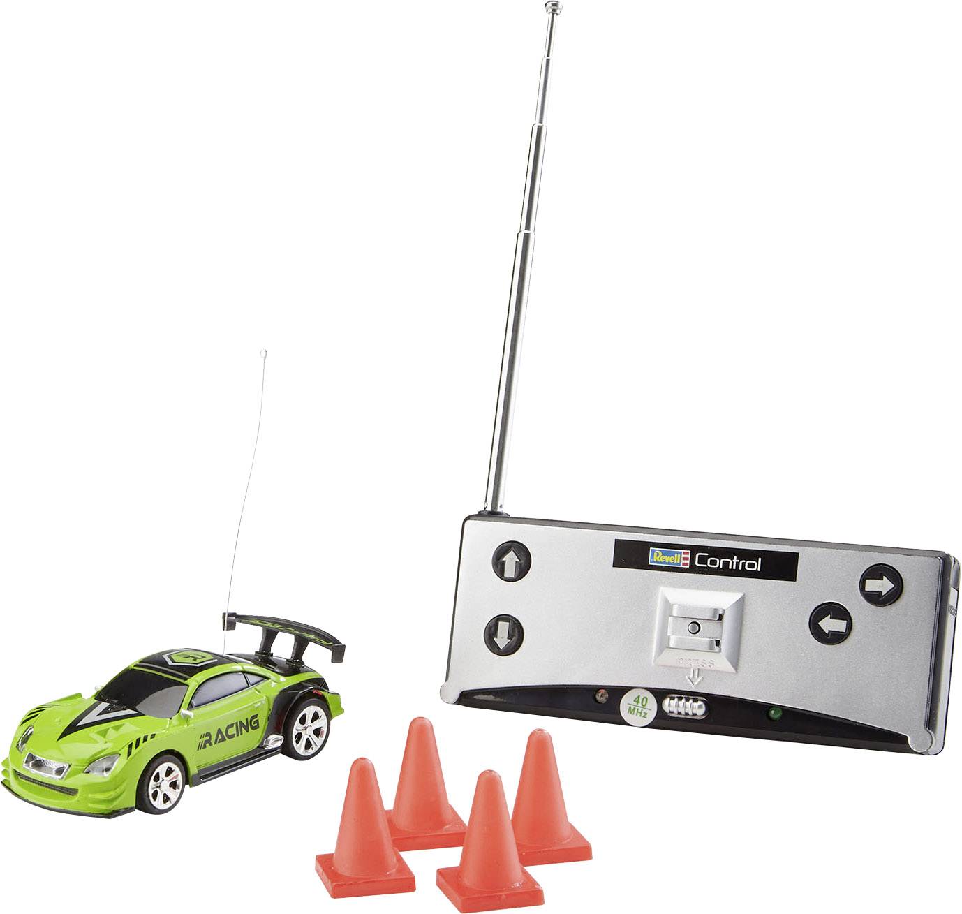 Remote-controlled toy racing car with an aerial and three orange traffic cones. The car is green and has a rear spoiler.