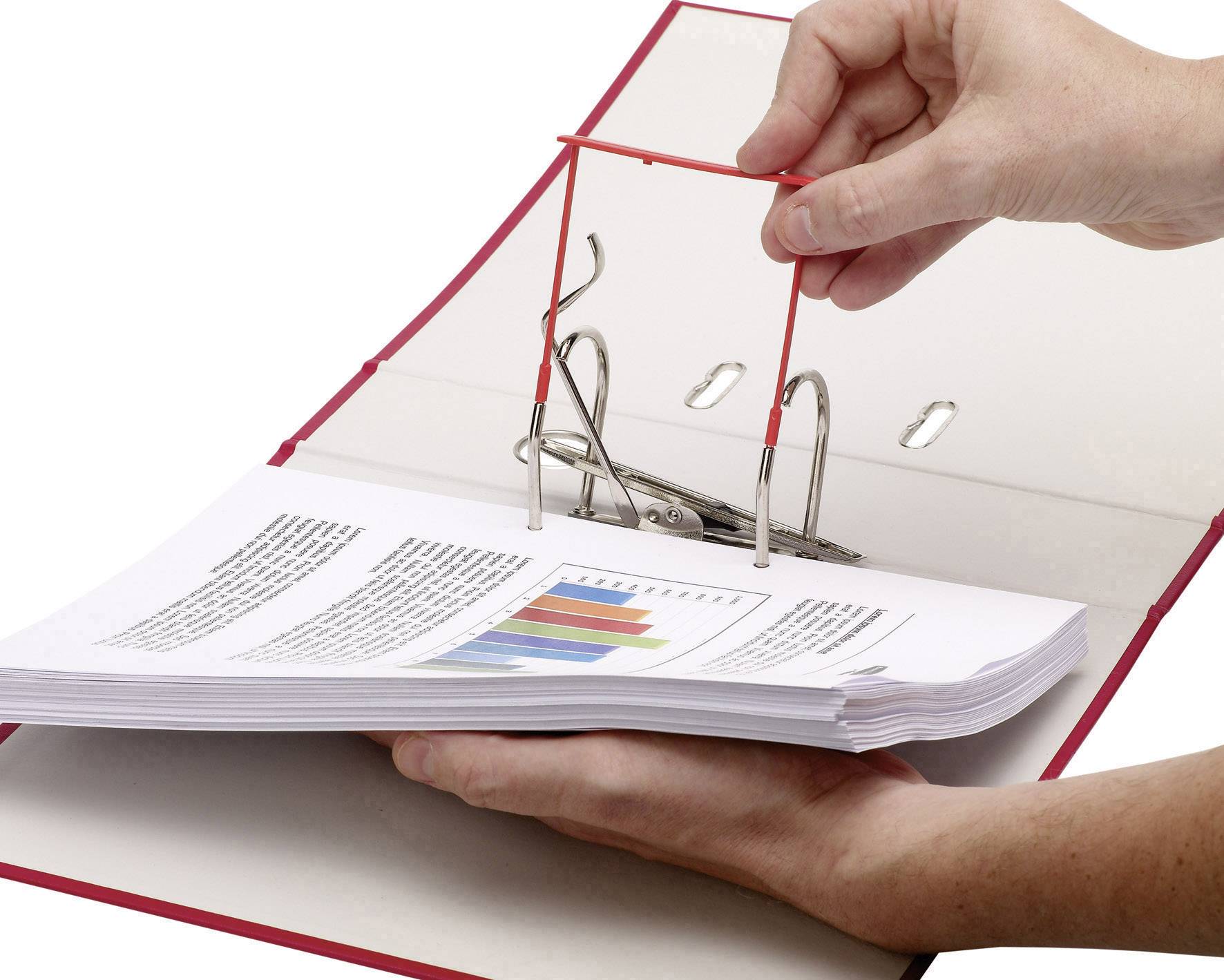 A hand opens a red ring binder containing documents with diagrams and text.
