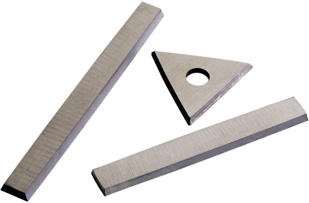 Three metal tools: rectangular blade, triangular blade with hole, flat rectangular blade. Used for machine processing.