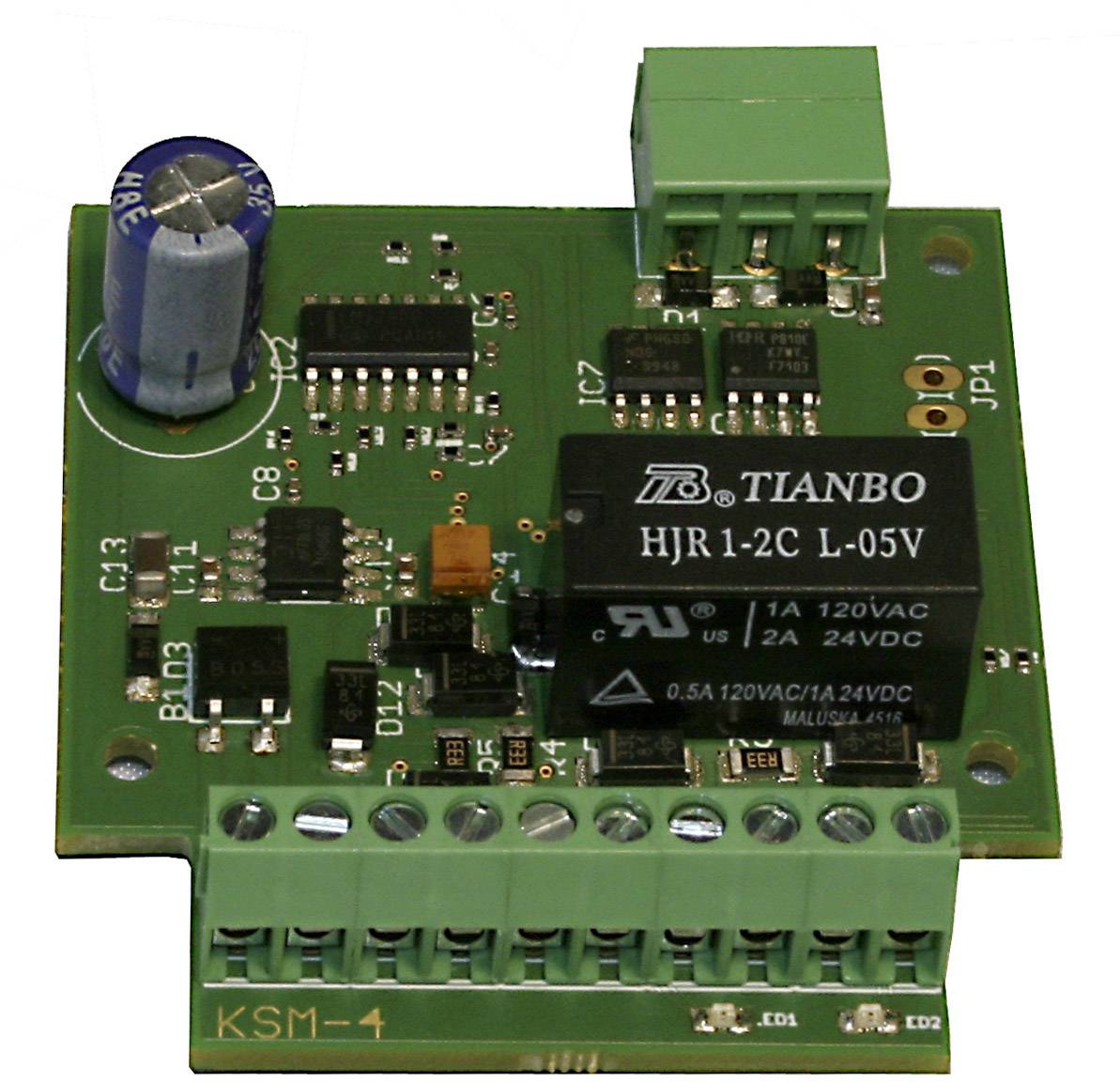 Electronic circuit board with various components, including a relay, capacitor and multiple connections, typically used for control systems.