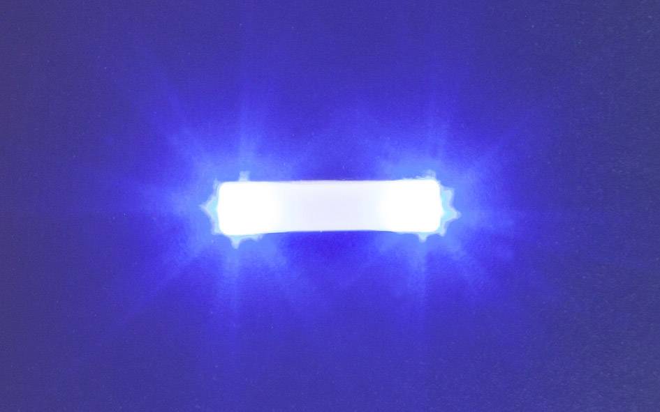 Bright blue LED light in a rectangular shape on a dark background.