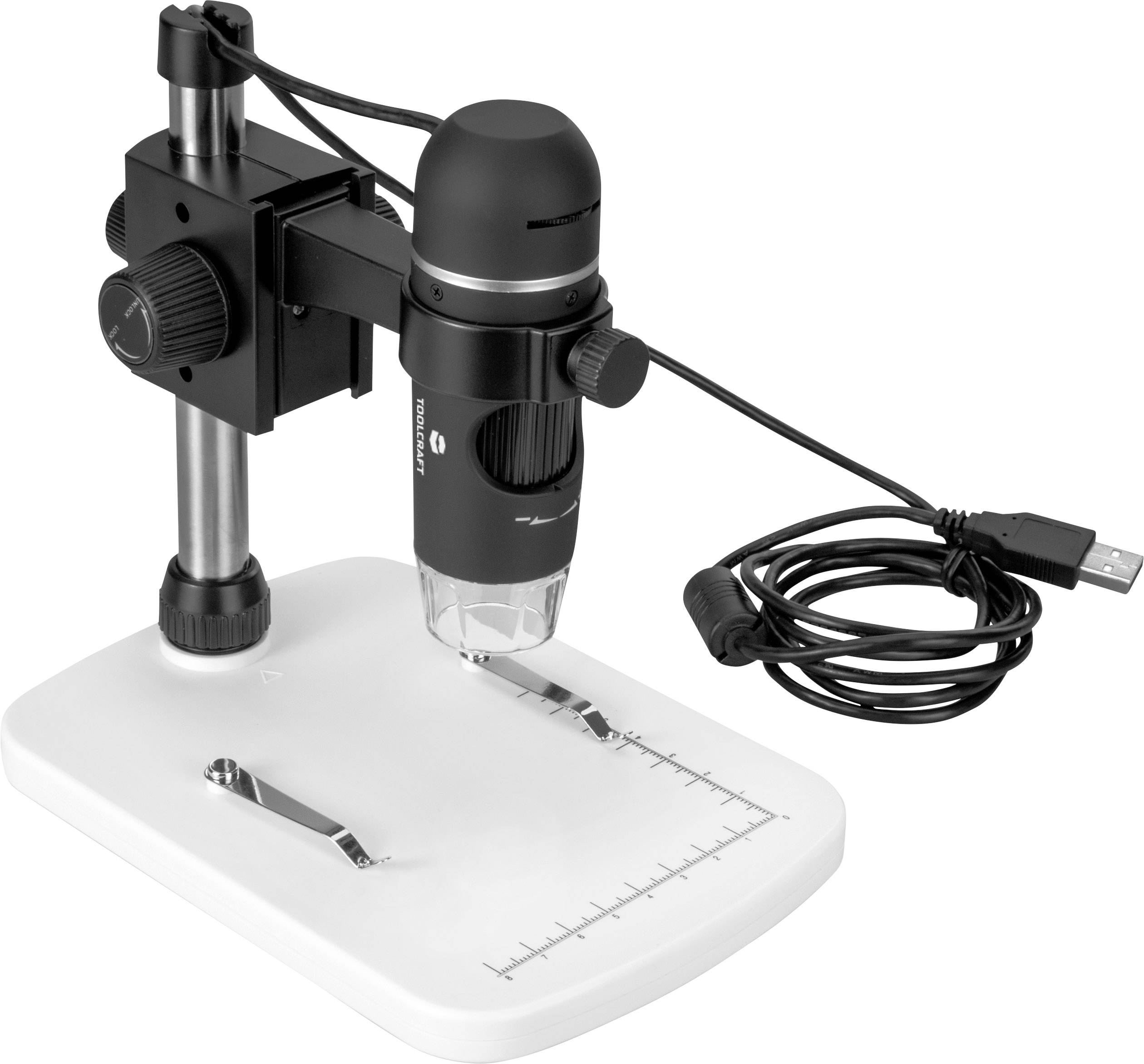 Digital microscope on a white base with ruler markings, connected via a USB cable.